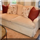 F01. A. Rudin cream colored sofa. 35”h x 84”w x 40”d 